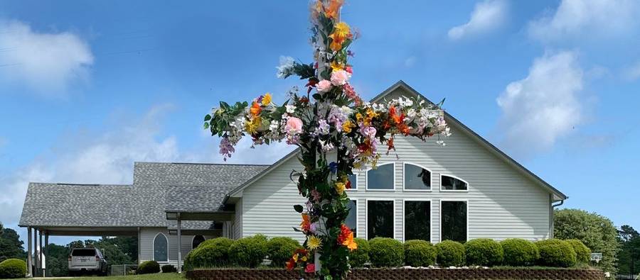 Lake Palestine UMC church building with flower cross