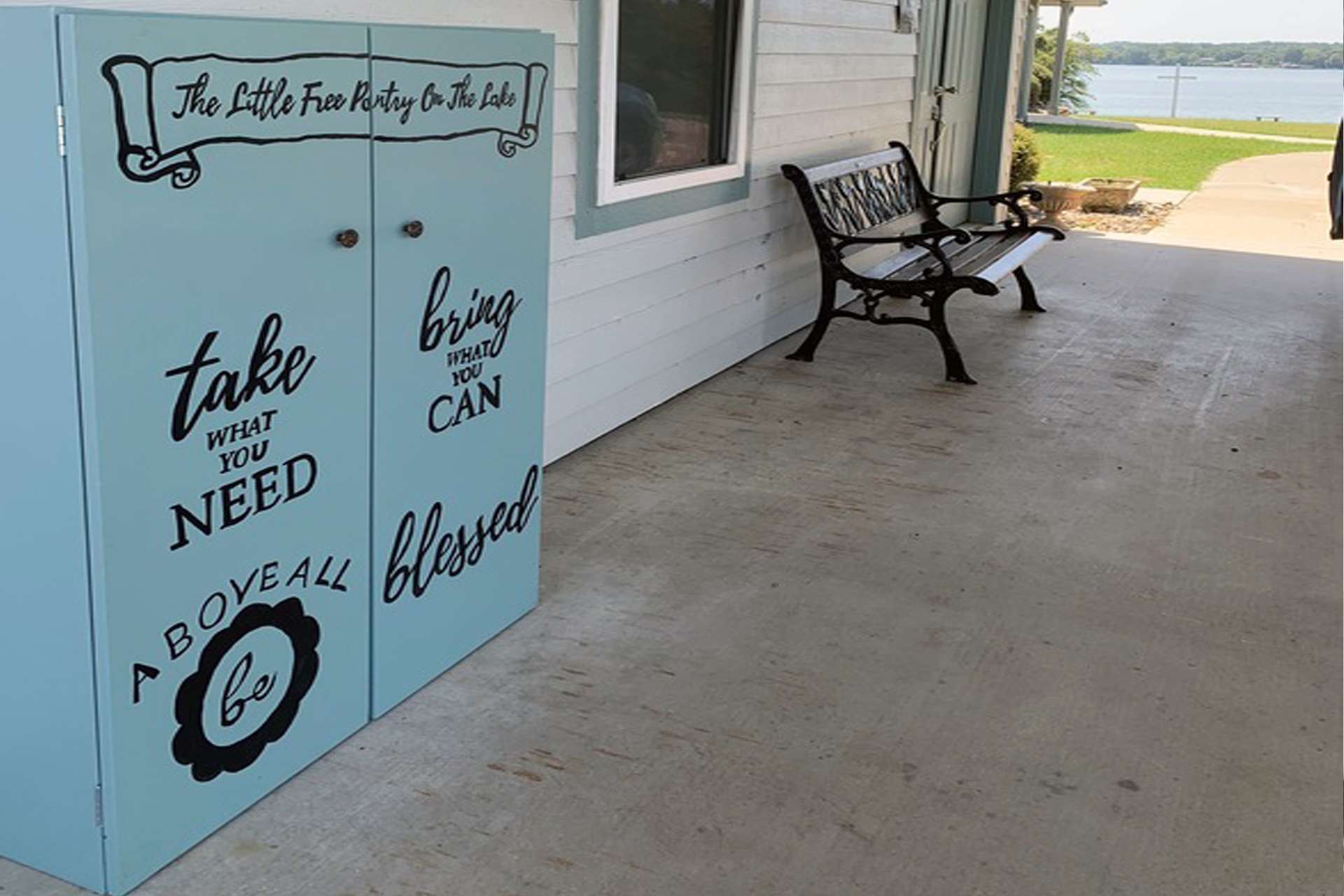 Wide view of the Little Free Pantry under the church carport